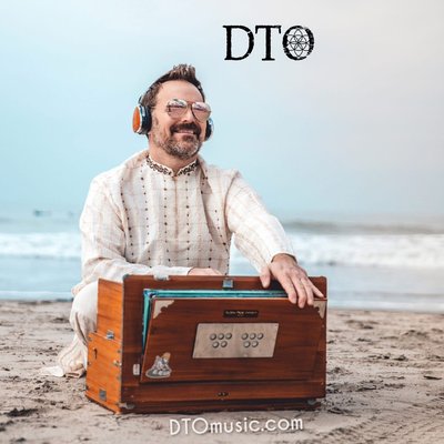 DTO at the harmonium on a beach