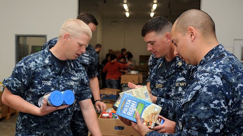 Volunteers sorting donated food