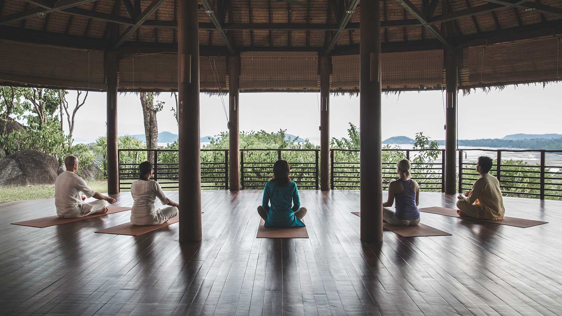 Group meditation in the yoga pavilion at Kamalaya Koh Samui